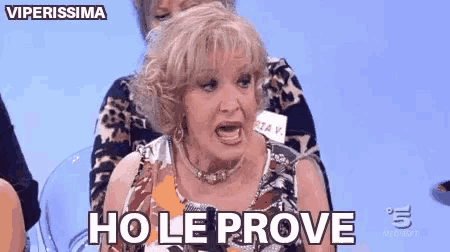 a woman is making a funny face and says ho le prove