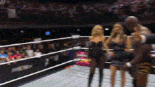 a blurred image of a wrestling ring with the letter w on the wall