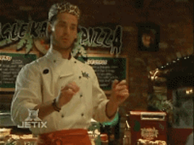 a chef in front of a sign that says glekarma