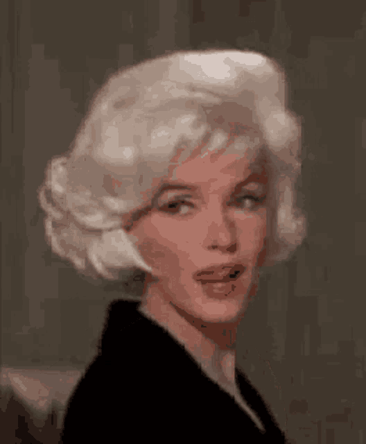 a close up of a woman 's face with blonde hair .