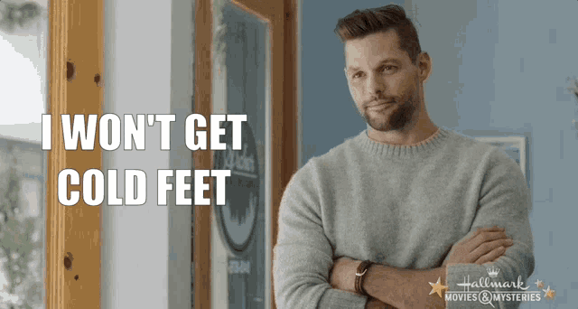 a man standing in front of a door with his arms crossed and the words i won t get cold feet