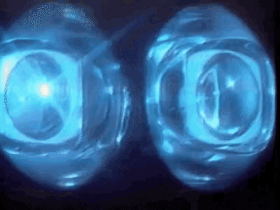 a close up of two blue spheres with the letter o on them