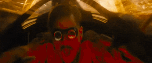 a blurry picture of a person riding a roller coaster at night