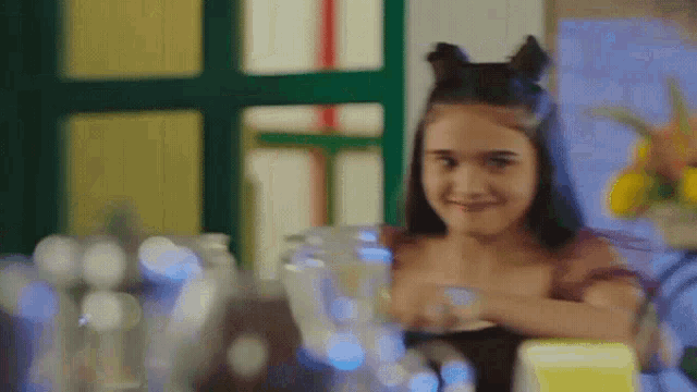 a girl wearing cat ears and a fairy costume
