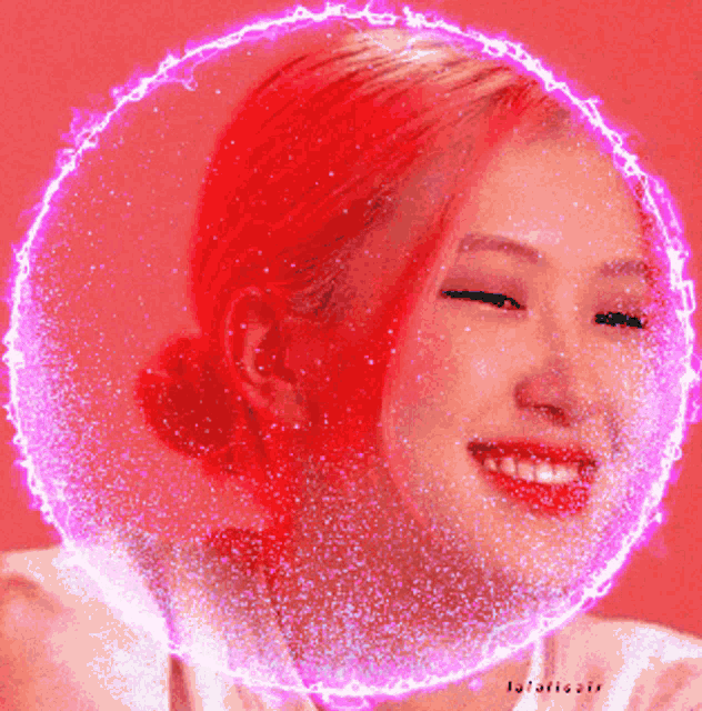 a woman with red hair is smiling in a pink circle with a glowing circle around her face