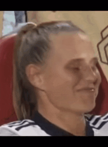 a close up of a woman making a funny face .