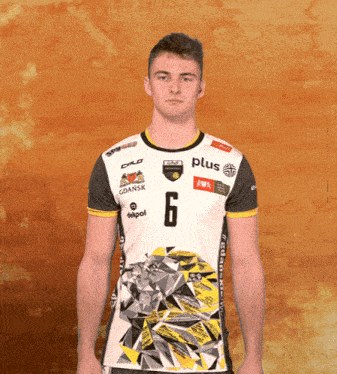 a man wearing a shirt with the number 6