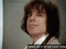 a close up of a man 's face with make gifs at gifsoup.com written on the bottom .