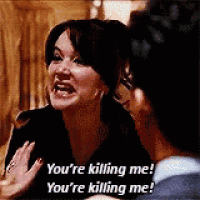 a woman is talking to a man and says `` you 're killing me ! ''