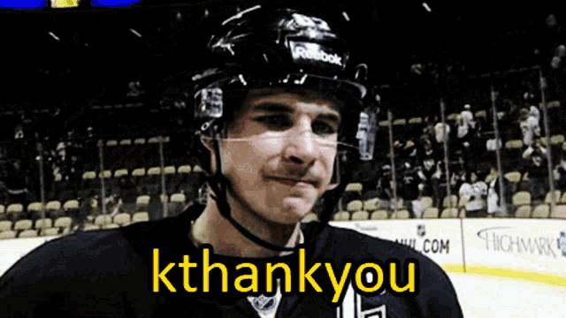 a hockey player says " kthankyou " while wearing a reebok helmet