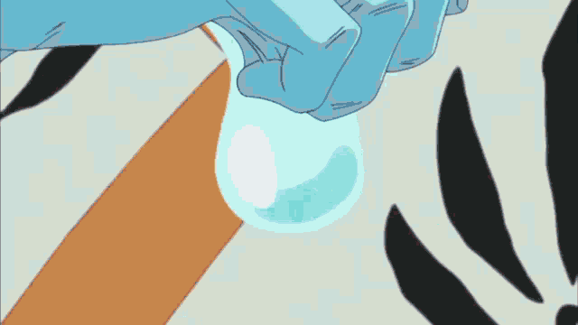 a person is holding a bottle of water in their hand .