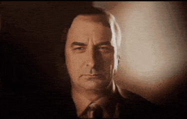 a man with a serious look on his face