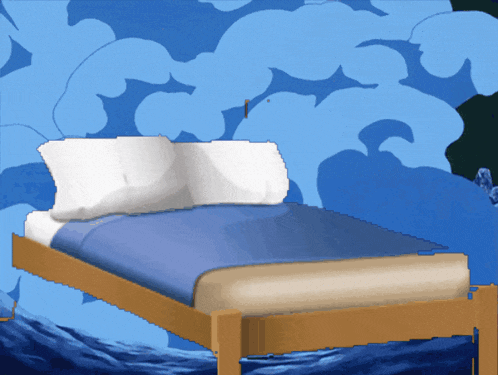 a bed with a blue blanket and white pillows in front of a blue wall with dolphins on it