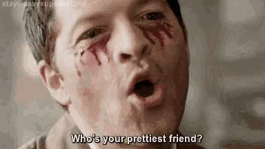 a man with blood on his face is making a funny face and asking who is your prettiest friend .