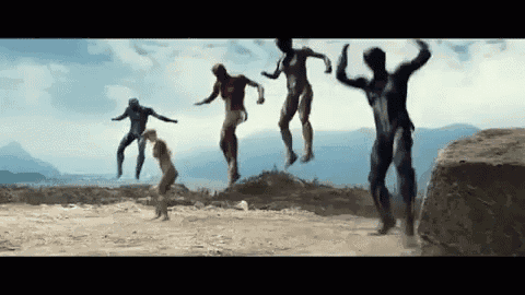 a group of people are jumping in the air with their arms outstretched