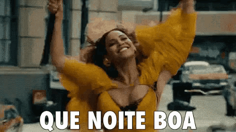 a woman in a yellow dress is dancing with her arms in the air and the words que noite boa are above her .