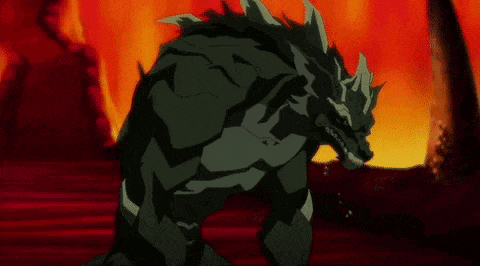 a cartoon monster is standing in front of a fire .