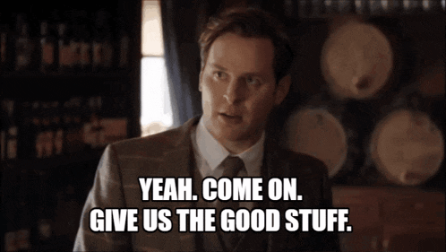a man in a suit says " yeah come on give us the good stuff "