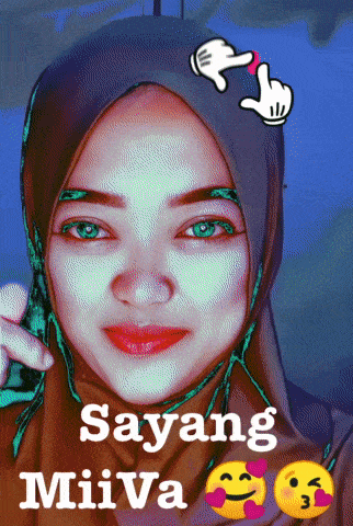 a picture of a woman wearing a hijab with the words sayang miiva below her