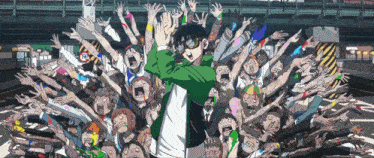 a man in a green jacket stands in front of a crowd of people