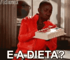 a man in a red jacket is holding a cake and says e-a-dieta ?