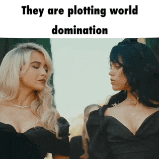 two women standing next to each other with the words they are plotting world domination above them