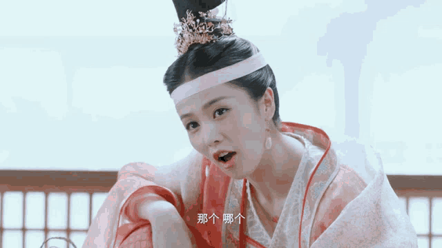 a woman with chinese writing on her face is wearing a tiara