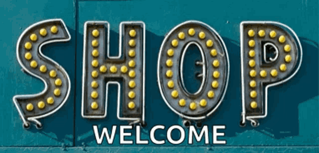 a sign that says shop welcome on a blue background