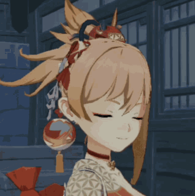 a close up of a girl with her eyes closed and a ball in her hair