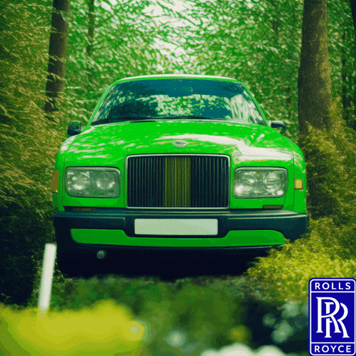 a green rolls royce car is parked in the middle of a forest