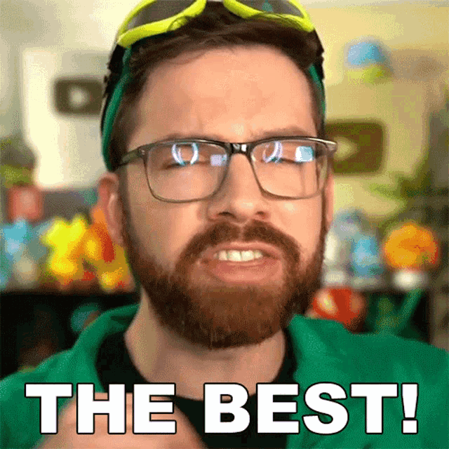 a man with glasses and a beard has the words the best on his face