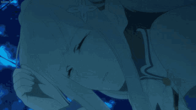 a person is touching another person 's face with a blue background