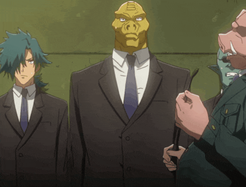 a group of men in suits and ties are standing together