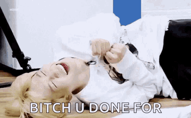 a person is laying on the floor with a spoon in their mouth and says `` bitch u done for '' .