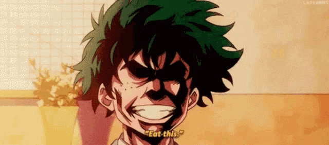 a close up of a cartoon character 's face with the words `` eat this '' on it .