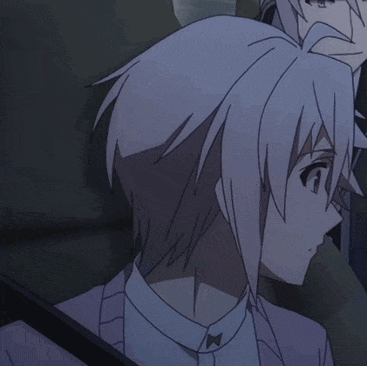 a man with white hair is sitting next to a man in a tuxedo