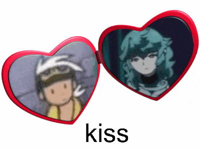 a red heart shaped mirror with a picture of a man and a woman and the word kiss below it
