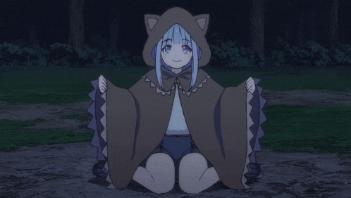 a girl with blue hair and a cat hood is sitting on the ground