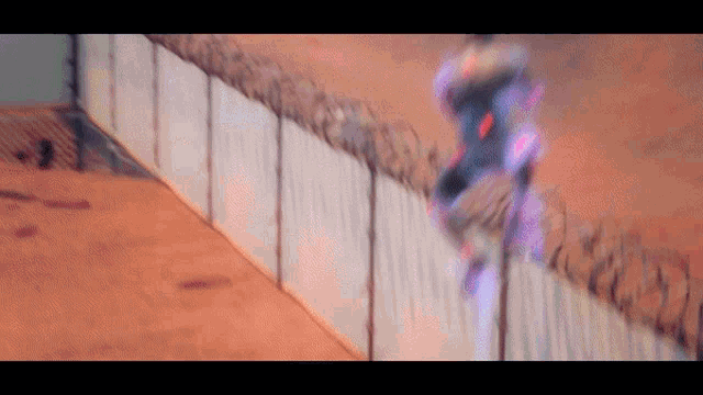 a blurred image of a person riding a skateboard