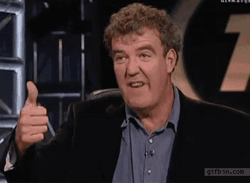 a man in a suit giving a thumbs up with gifbin.com at the bottom