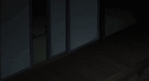 a cartoon character is crawling on the floor in the dark .