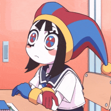 a cartoon girl wearing a jester hat sits at a desk