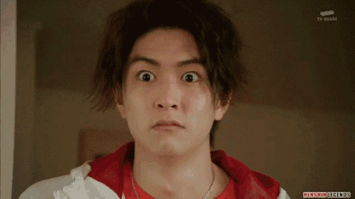 a close up of a man 's face with a tv asahi logo visible