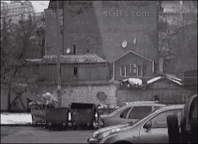 a 4gifs.com image of a parking lot with cars
