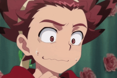 a close up of a cartoon character with red hair making a funny face