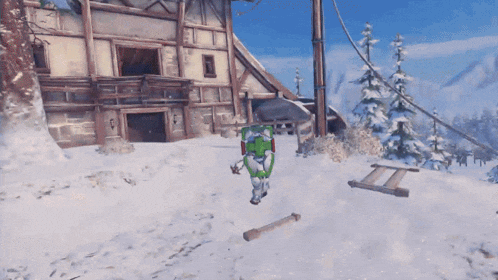 a person with a green shield is standing in the snow near a building