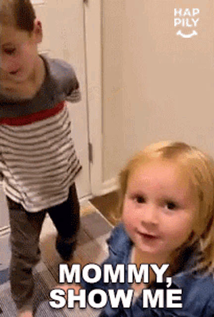 a boy and a girl are standing next to each other and the girl is saying " mommy show me "