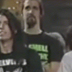 a blurry picture of a man wearing a shirt that says ' nirvana '
