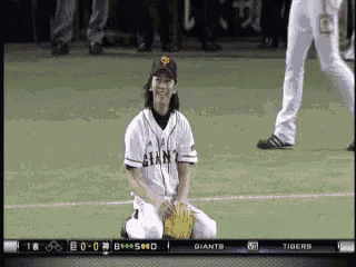 a giants player is kneeling on the field
