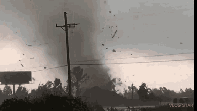a vlog star video shows a tornado moving through a rural area